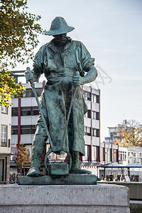 一名矿工终身铜质纪念碑胜利地标雕像钢铁天空绿色城市蓝色雕塑青铜图片