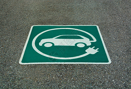 EV  电动车辆充电站标志 沥青纹理上的E标志汽油活力插头收费能源运输杂交种电气车站力量图片