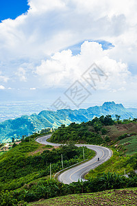 晨雾中的山坡路线缠绕街道天空旅游运输岩石全景公园沥青图片