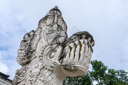 印尼巴厘岛寺庙的亚洲龙石雕塑旅行艺术吸引力地标雕刻雕像文化天空历史性宗教图片