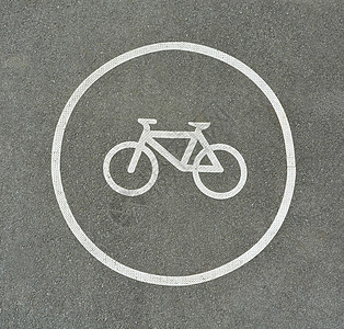 沥青纹理上的自行车标志 标明公路上的自行车车道水泥途径城市交通旅行安全踏板路标路线民众图片