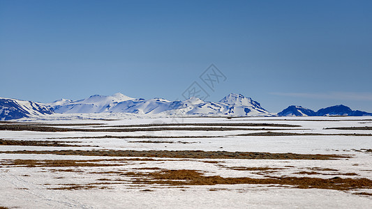 冰岛的景观丘陵雪帽晴天地形农村土地天气旅行荒野风景图片