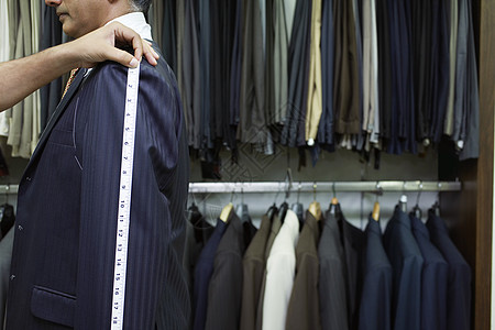 用于测量实服侧观的商务人士裁量器卷尺戏服职业裁缝店衣服中年商务生意男子人士图片