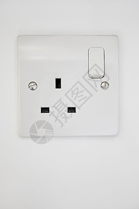 电源插在白墙上活力电子产品正方形静物几何电气插座开关技术概念图片