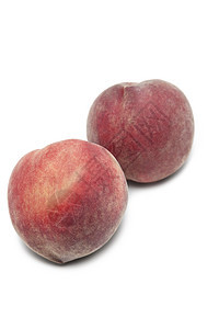 白色背景的两桃桃静物生产圆圈圆形食物营养水果健康饮食影棚图片