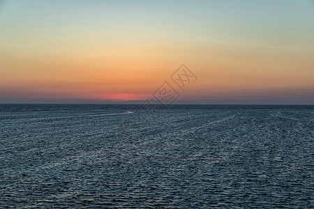 美丽的日落在地平线上海浪蓝图橙子黄色海洋天空太阳蓝色海岸海滩图片