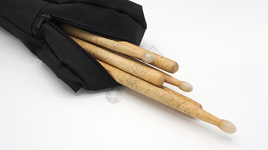 用实木材料制成的鼓棒手袋黑色乐器鼓袋木头岩石鸡腿织物塑料工作室图片