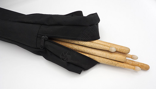 用实木材料制成的鼓棒音乐黄色齿轮韵律织物工作室木头鸡腿黑色手袋图片