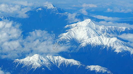 东藤山周围雪丘的顶角图像山脉岩石冰川旅行鸽子天空顶峰风景爬坡道白色图片