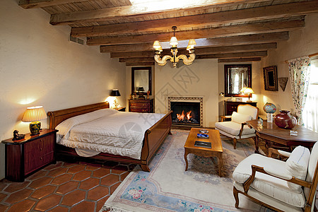 卧室内部框架家庭木头设计内阁桌子场景奢华壁炉被子图片