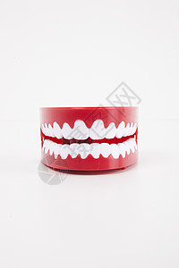 白色背景上方的人工假牙健康保健牙科对象器材牙齿塑料影棚卫生生物学背景图片