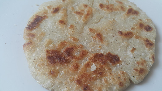 近距离观察传统家庭制作的面包 称为Jawar rodi或bhakri营养食物下颚香菜面粉餐厅绿色食谱公克图片
