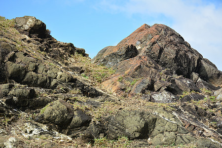 Daano海滩度假胜地岩层海浪编队土地冒险岩石巨石蓝色天空山脉海洋图片