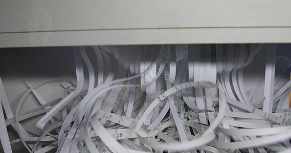 办公室的机密信件Schredder碎条碎纸纸屑安全碎纸机带子破坏回收粉碎垃圾废料图片