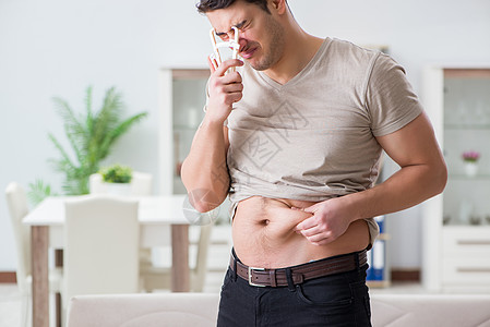 体脂肪和卡利帕的测量人食物腹部饮食肚子躯干检查统治者重量腰围肥胖图片