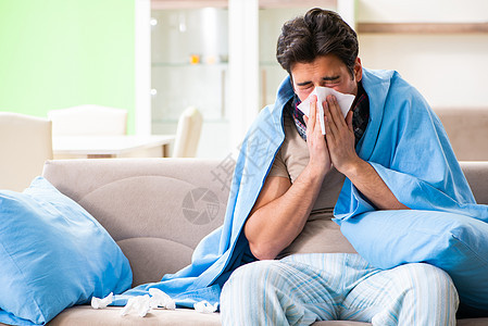 家里患有流感的患病青年男子痛苦过敏毯子症状药品组织长椅保健感染疾病图片