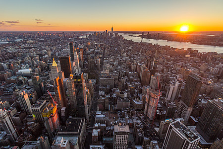 曼哈顿市风景 纽约州纽约 美国亚美州日落市中心天线金融城市建筑学商业地标建筑摩天大楼太阳图片