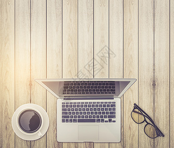 现代工作办公台顶端视图     笔记本或l电脑桌面商业空白作品杯子桌子公司棕色咖啡图片