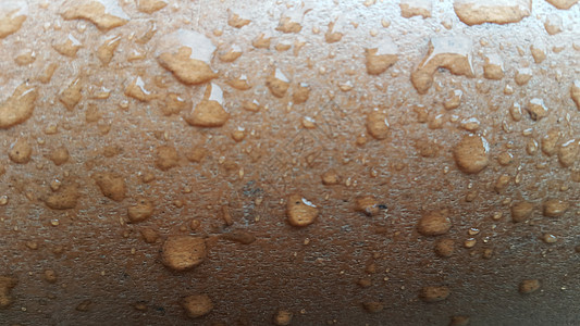 木地板上的水滴反射木头飞沫雨季雨滴棕色瓷砖地面石板粉色图片