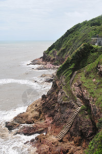 海景和山坡与悬崖 旧楼梯下悬崖 佩里德岛汶府唱歌公园岩石活动海岸海滩旅行旅游地标图片