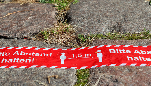 保持德国语言的距离符号  1保健人行道暴发注意力警告地面仪表感染安全街道图片