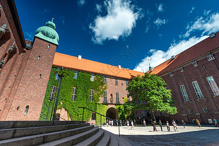 瑞典斯德哥尔摩市市政厅遗产天空历史性城堡太阳大厅窗户旅行叶子蓝色图片