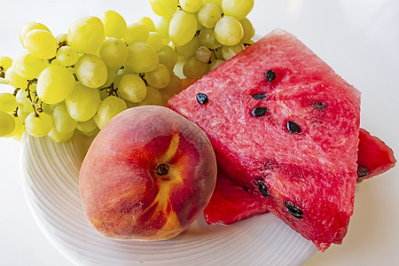 桃子 西瓜和盘子里的葡萄果水果饮食活力静物维生素甜点小吃热带团体食物图片