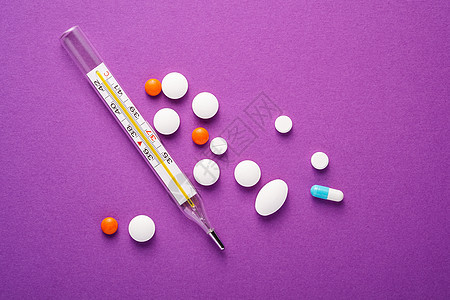紫紫底紫色底的药片 平板和模拟温度计疾病温度帮助止痛药药品治愈剂量疼痛制药药物图片