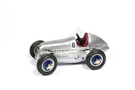 白色背景的老旧古典玩具铁赛车驾驶红色收藏品运输乐趣发动机汽车车轮车辆速度图片
