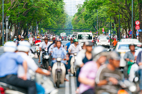 越南胡志明市繁忙的街道运输驾驶危险城市旅行速度头盔摩托车骑士自行车图片