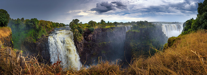 津巴布韦赞比西河上的维多利亚瀑布全景荒野日落风景国家阳光旅游瀑布流动热带彩虹图片