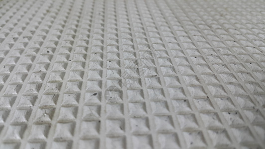 白色3D几何形状的地板瓷砖灰色颜色近距离石膏岩石地面城市街道路面粒状墙纸石头材料图片