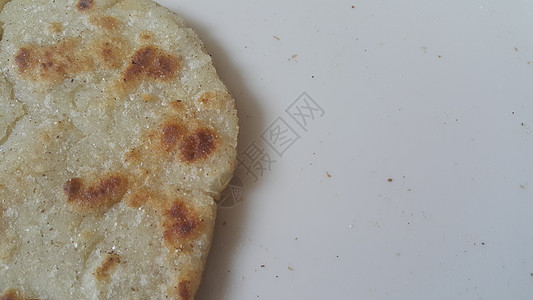 近距离观察传统家庭制作的面包 称为Jawar rodi或bhakri食物餐厅下颚香菜营养面粉绿色公克食谱图片