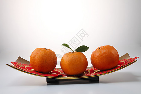 内橘橙色节日小吃橙子甜点叶子季节文化食物传统热带图片