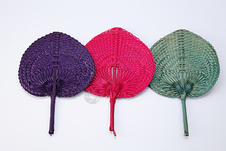 风扇手扇文化红色紫色稻草团体工艺编织手工白色图片