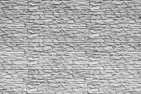 黑色和白色的墙纹 上面盖着装饰砖块花岗岩水泥长方形建筑学接缝马赛克建筑石墙石头制品图片