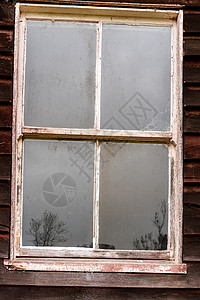 废弃社区大厅古窗的反省活动 被遗弃社区厅娱乐农村邻里居民木材树木国家玻璃回忆舞蹈图片