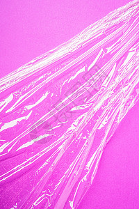 粉红背景的拉伸包装塑料 最小创造性布局图片