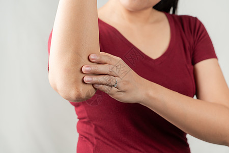 手肘疼痛 年轻妇女受伤 医疗保健和医疗概念手臂压力药品手指治疗按摩背痛肌肉皮肤女性图片