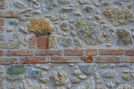 由石头 砖块和混凝土制成的旧墙状边界水泥鹅卵石砖墙房子石墙建筑石工古董建筑物图片