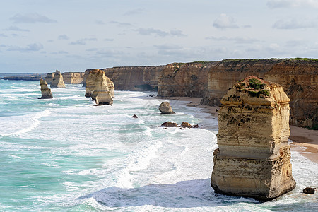 澳大利亚深知十二门徒大大洋路澳洲公园访客旅行岩石海岸线天气旅游石灰石悬崖游客背景图片