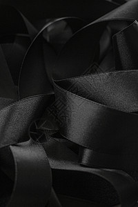 黑丝带作为背景 抽象和奢侈品牌设计曲线工作室阴影皮革反射丝带丝绸黑色奢华桌面背景图片