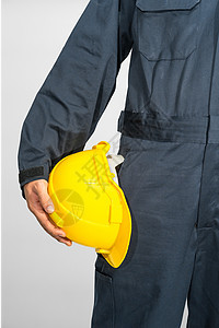 站在蓝色封面上站着的工人 都拿着硬帽职业安全帽头盔检查员男人安全工作男性手臂建筑师背景图片