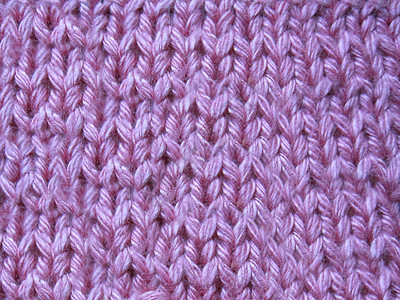 粉色编织毛衣 用网格图案手工制作图片