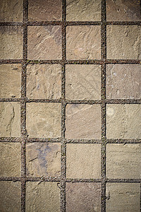 路边铺满了铺垫的石砖 脚印 背面花岗岩建筑学建造正方形地面涂层城市棕色小路街道背景图片