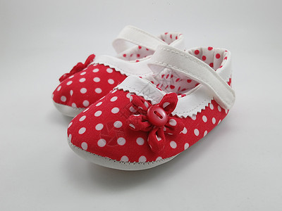 红波尔卡点婴儿鞋红色打印配饰孩子产品带子背景图片