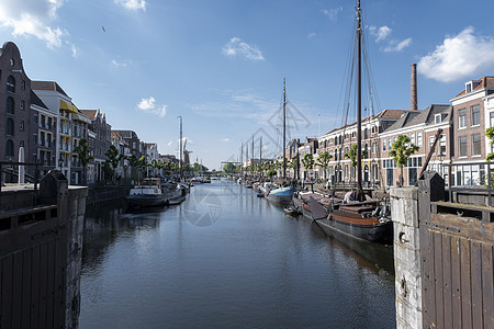 荷兰鹿特丹历史悠久的德尔夫沙文地区城市景观建筑学风车蓝色港口旅行国家历史性保护图片