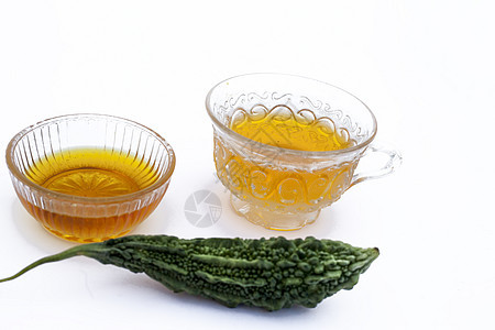 白色分离的流行排毒凉茶 即与蜂蜜及其成分分离的苦瓜或苦黄瓜茶杯子柠檬绅士饮料饮食薄荷黄瓜葫芦苦瓜子香脂背景图片