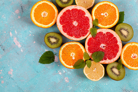 蓝底柑橘 柠檬 葡萄果和石灰的柑橘水果橙子果汁热带蓝色饮食团体叶子排毒薄荷柚子图片