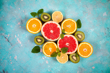 蓝底柑橘 柠檬 葡萄果和石灰的柑橘水果热带蓝色食物柚子奇异果素食主义者橙子叶子饮食果汁图片